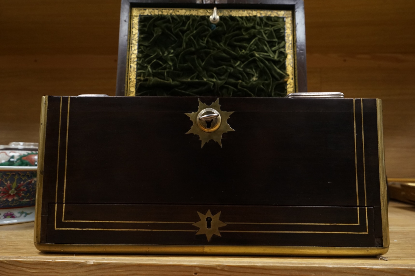 A mid 19th century mahogany brass bound and mounted toilet box, with tooled leather and velvet interior. Fitted inside with glass plated topped bottles and boxes. 31cm wide x 19cm high